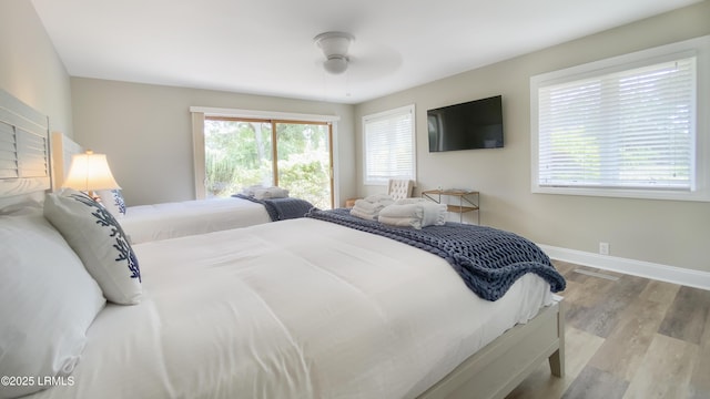 bedroom featuring ceiling fan and light hardwood / wood-style floors