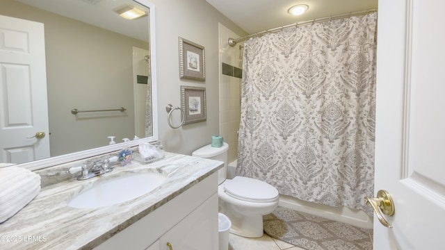 full bathroom with tile patterned flooring, vanity, toilet, and shower / bath combo with shower curtain