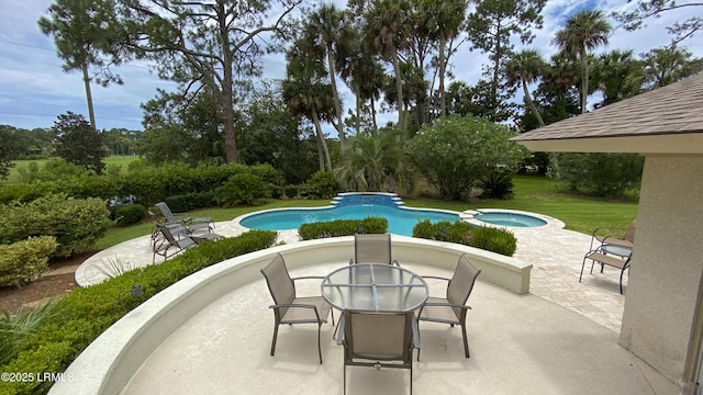 view of pool featuring an in ground hot tub and a patio area