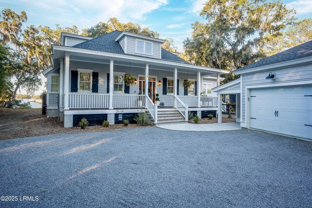 view of front of property with a garage and covered porch