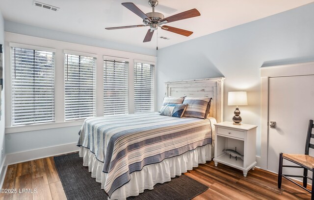 bedroom with dark wood-type flooring and ceiling fan