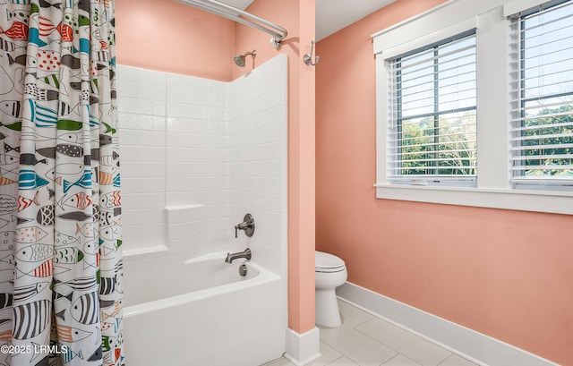 bathroom featuring toilet, tile patterned flooring, and shower / bath combo with shower curtain