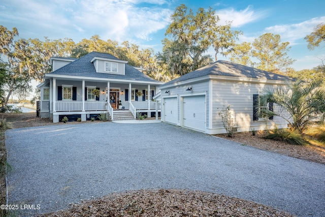 view of front of property with a garage and covered porch