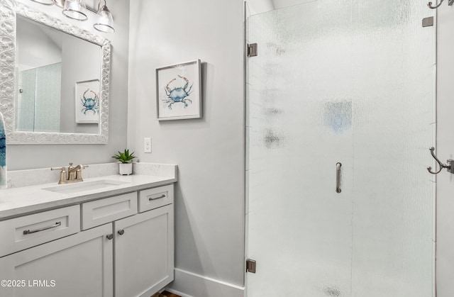 bathroom with vanity and walk in shower