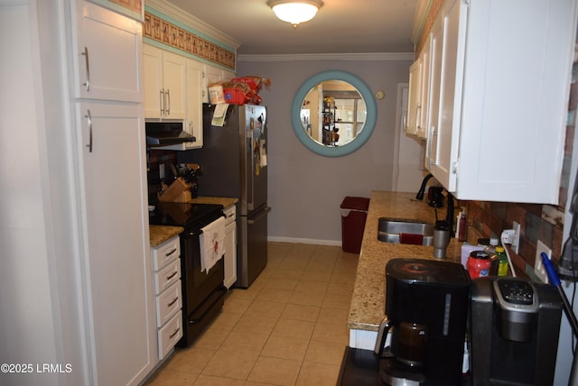 kitchen featuring sink, crown molding, light tile patterned floors, black / electric stove, and white cabinets