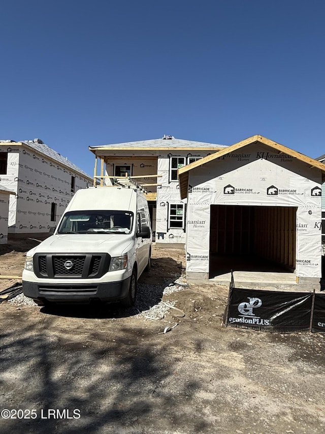 property under construction with an attached garage
