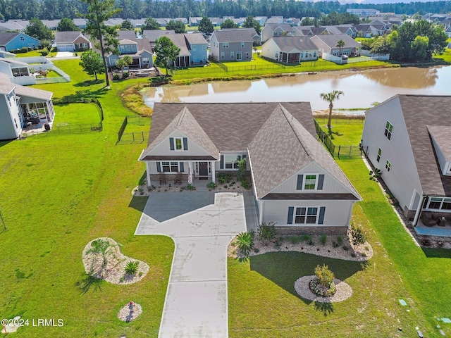 birds eye view of property featuring a residential view and a water view