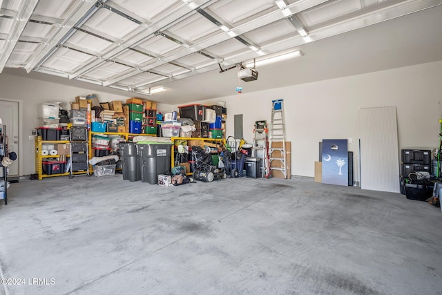 garage featuring a garage door opener and electric panel