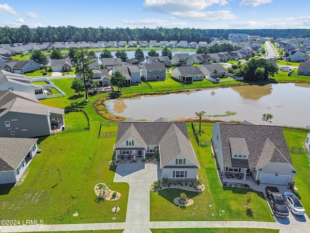 birds eye view of property featuring a water view and a residential view