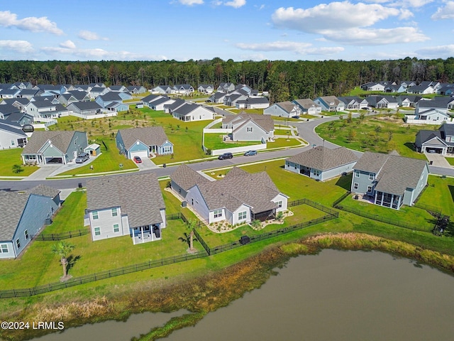 aerial view with a residential view and a water view