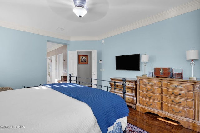 bedroom with hardwood / wood-style flooring, ceiling fan, and ornamental molding