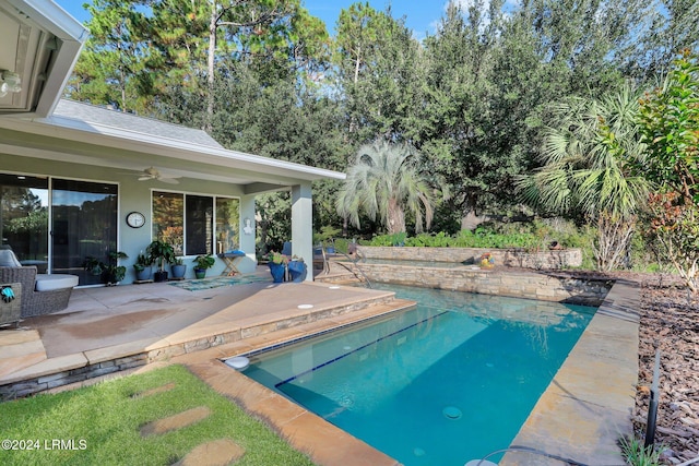 view of pool with ceiling fan and a patio area