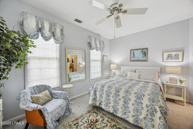2 Lenox Ln, Hilton Head Island, SC 29926 - carpeted bedroom featuring multiple windows, baseboards, and ceiling fan