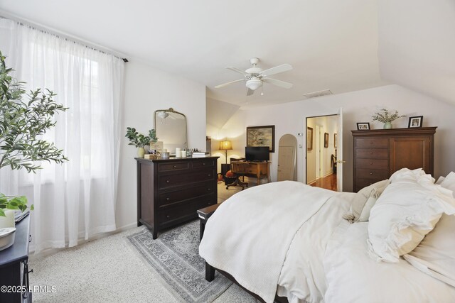 2 Lenox Ln, Hilton Head Island, SC 29926 - bedroom with an office area, a ceiling fan, vaulted ceiling, light colored carpet, and baseboards