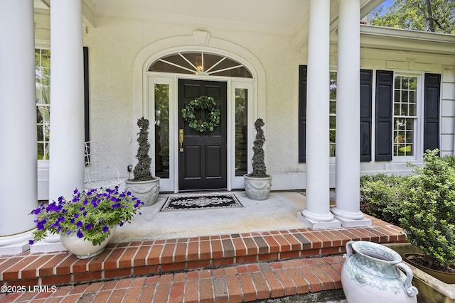 2 Lenox Ln, Hilton Head Island, SC 29926 - property entrance with covered porch and stucco siding
