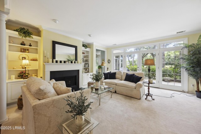 2 Lenox Ln, Hilton Head Island, SC 29926 - living room with crown molding, light colored carpet, a fireplace, and built in shelves