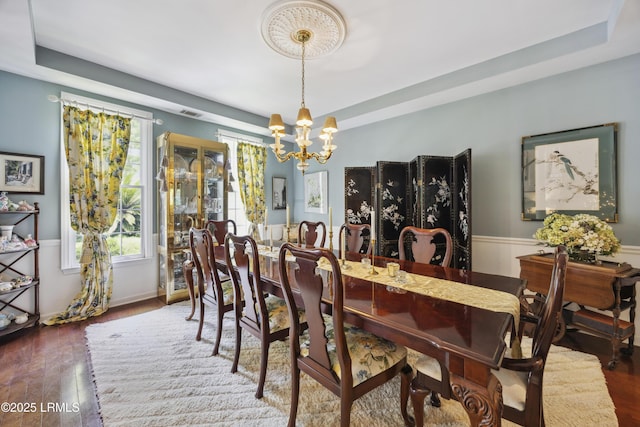 2 Lenox Ln, Hilton Head Island, SC 29926 - dining space with healthy amount of natural light, a chandelier, and a raised ceiling