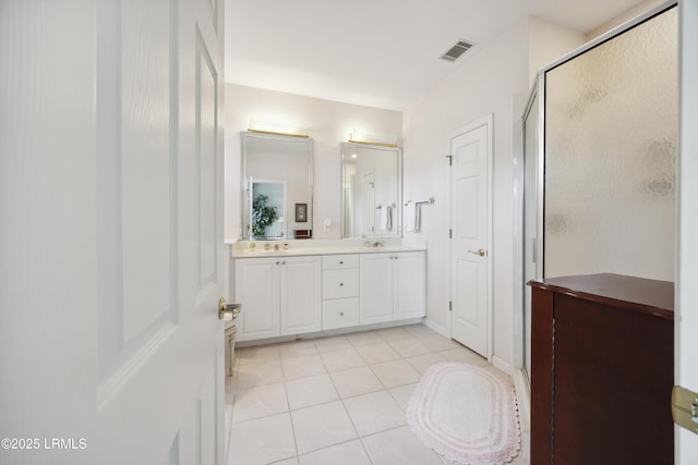 2 Lenox Ln, Hilton Head Island, SC 29926 - bathroom featuring double vanity, a shower stall, and tile patterned flooring