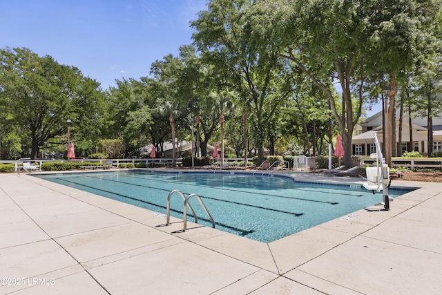 2 Lenox Ln, Hilton Head Island, SC 29926 - community pool with view of scattered trees and a patio