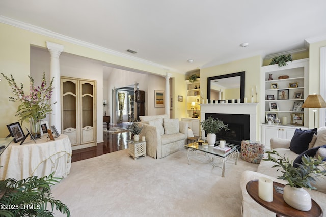 2 Lenox Ln, Hilton Head Island, SC 29926 - living room with crown molding, ornate columns, a fireplace, and built in features