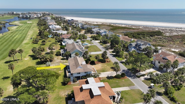 bird's eye view with a water view and a beach view