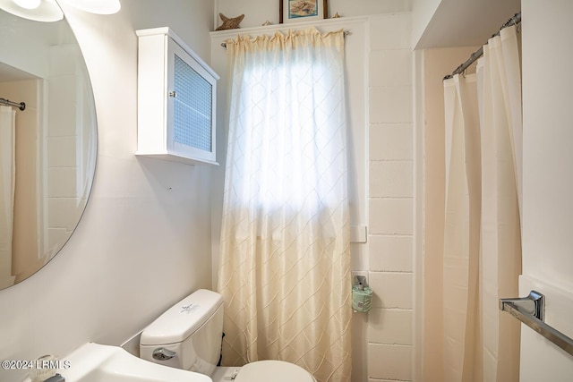 bathroom featuring toilet