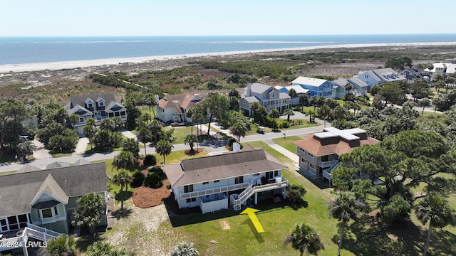 bird's eye view with a water view and a beach view