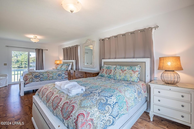 bedroom featuring hardwood / wood-style floors and access to outside