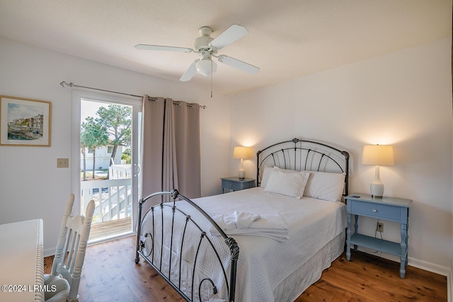 bedroom with access to outside, dark hardwood / wood-style floors, and ceiling fan