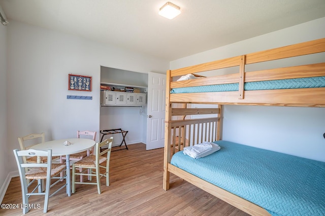 bedroom with hardwood / wood-style floors