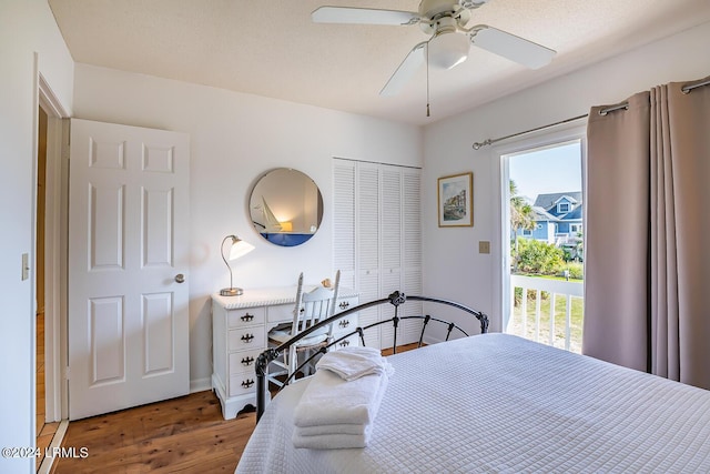 bedroom featuring hardwood / wood-style floors, a closet, and ceiling fan