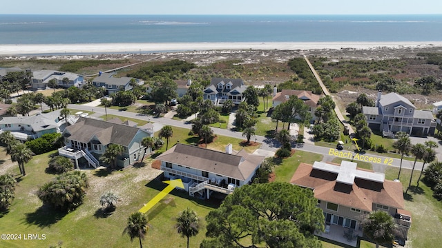 aerial view with a water view and a view of the beach