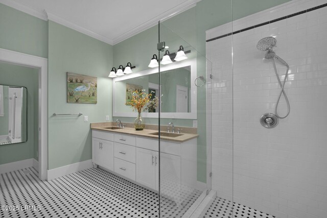 bathroom with ornamental molding, tiled shower, and vanity