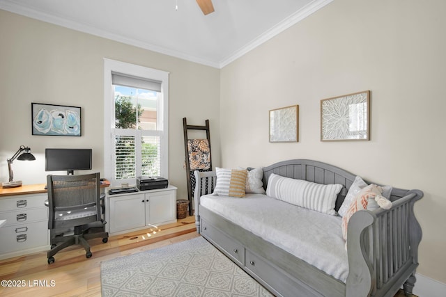 bedroom with ceiling fan, ornamental molding, and light hardwood / wood-style flooring