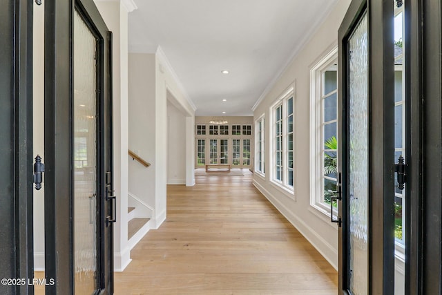 4 Wedgewood Cir, Bluffton, SC 29910 - foyer entrance featuring light wood-type flooring, plenty of natural light, baseboards, ornamental molding, and stairs