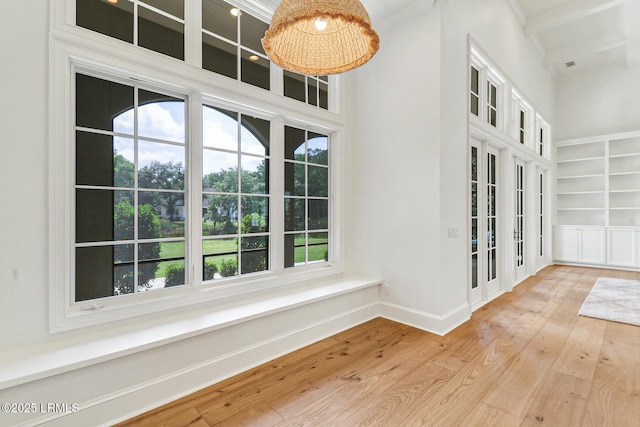 4 Wedgewood Cir, Bluffton, SC 29910 - empty room with hardwood / wood-style floors, built in shelves, baseboards, and crown molding