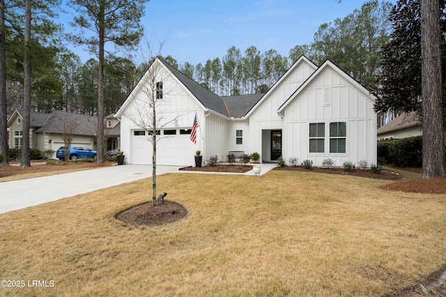 modern farmhouse with a garage and a front lawn