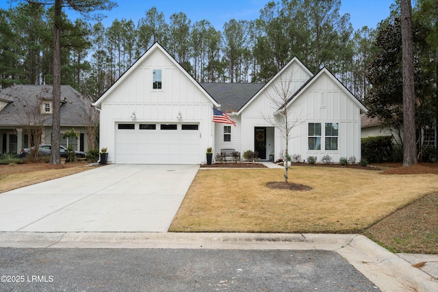 modern inspired farmhouse featuring a garage and a front lawn