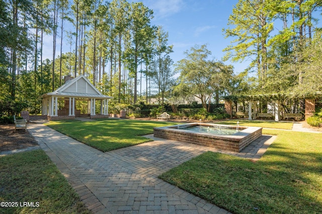 view of home's community with a yard