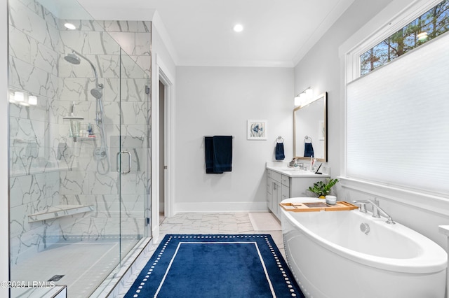 bathroom featuring ornamental molding, shower with separate bathtub, and vanity