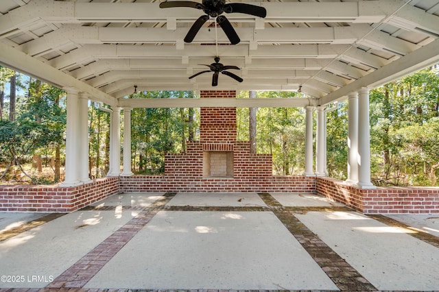 view of patio / terrace with an outdoor brick fireplace and ceiling fan