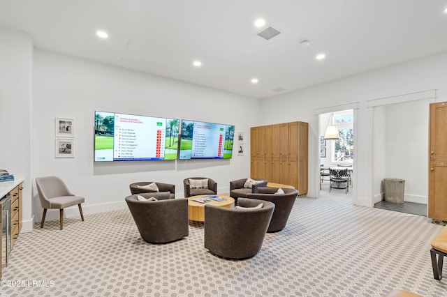 carpeted living room with wine cooler