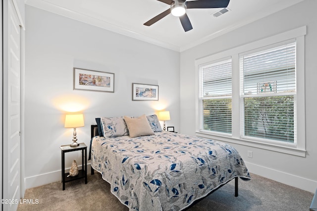 bedroom with carpet floors, ornamental molding, and ceiling fan