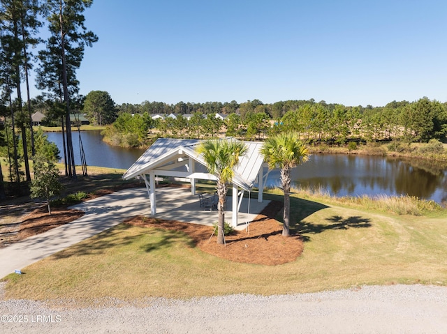 dock area featuring a yard and a water view