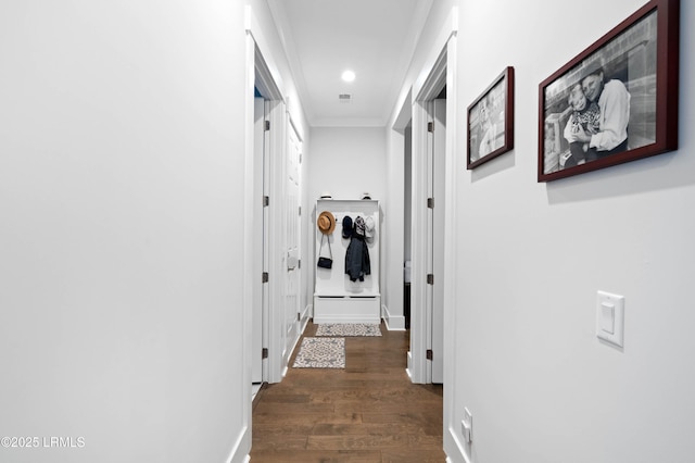 corridor with dark hardwood / wood-style flooring