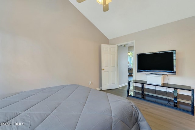 bedroom with high vaulted ceiling, hardwood / wood-style floors, and ceiling fan