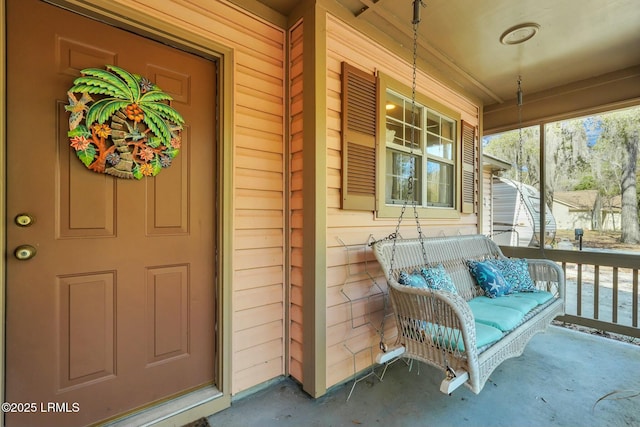 doorway to property featuring covered porch