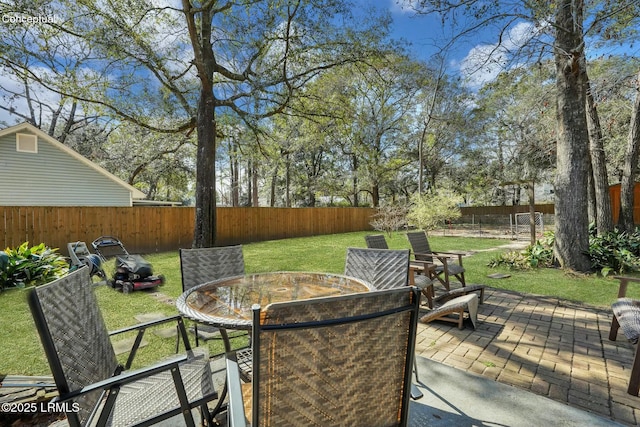 deck featuring a yard and a patio area