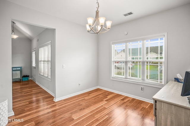 91 Heartstone Cir, Bluffton, SC 29910 - unfurnished dining area with a chandelier and light wood-style flooring