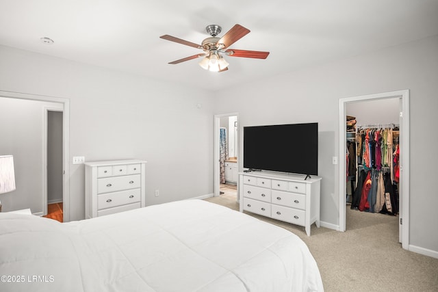 91 Heartstone Cir, Bluffton, SC 29910 - bedroom with a walk in closet, a closet, light colored carpet, ensuite bath, and a ceiling fan